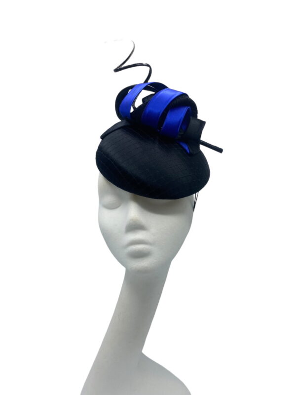 Stunning black satin headpiece with navy blue swirl detail.